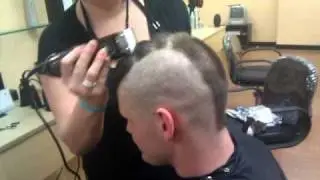 Zac gets his head shaved.