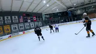 Minn takes the puck up the ice, in the zone, and scores one low