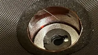 How to remove debris stuck in voice coil