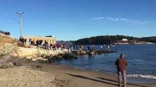 Hundreds watch Zumwalt destroyer making its way down Kennebec River