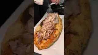 The secret-menu Porchetta Pizza Calzone from Rocco&rsquo;s of Rockaway Beach in Queens, NYC! #DEVOURPOWER
