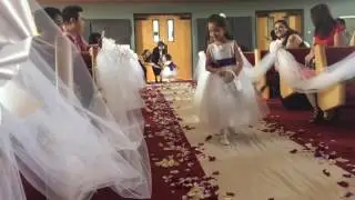 2 yr old flower girl Franzelle walking down the aisle