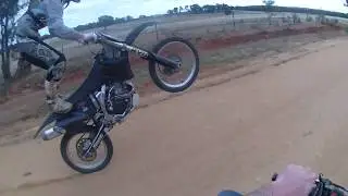 POV Dirt bike wheelie standing on seat