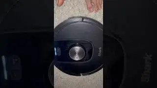 POV spot cleaning my closet with a Shark robot vacuum cleaner at night