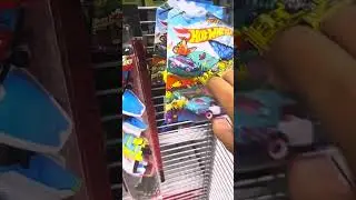 Looking at a shelves of Hot Wheels cars, Maisto, and Matchbox cars and Powergrabs! at a Five Below!