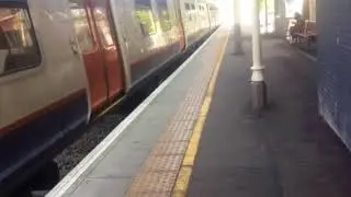 London overground class 315 departing at highams Park