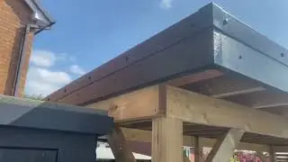 Bespoke timber pergola with rubber roof and uPVC roofline