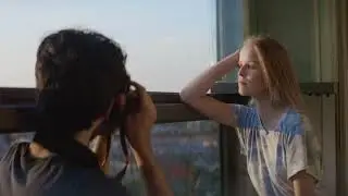 Woman Leaning On Her Arm On A Window Sill And Posing For Camera   Stock Video Footage