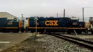 Westbound CSX L422 crossing JO tower with a Slug mate 