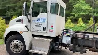 Pack Rat truck loading a moving pod