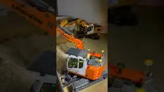 Liebherr 946 und 914 Compact Modellbagger bei Nacht