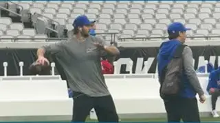 Josh Allen warms up