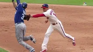 KC@PHI: Hernandez applies tag, throws to first base