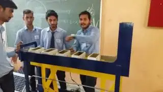 Solar operated conveyor and stamping mechanism....