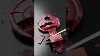 ASMR:  Crimson jasper shaped like a vintage key sliced cleanly with a razor-sharp blade
