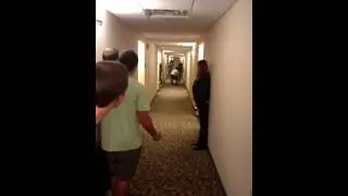 Sliding on pizza boxes in a hotel hallway 3