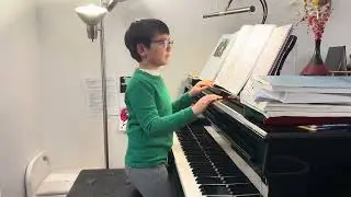 Little boy’s Christmas piano medley