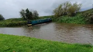 Winding a narrowboat in windy weather,  Wychnor, Trent and Mersey canal.  Turning a narrowboat.