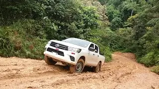 Toyota Hilux and Nissan Frontier On Muddy Climbing Routes - Pickup Truck On Mud Climb Track