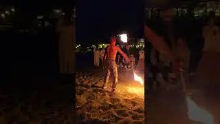 Daring Fire Performance on the Beach at Night