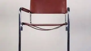 Tubular steel cantilever chair