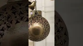 Iron lantern with beautiful bird and bells