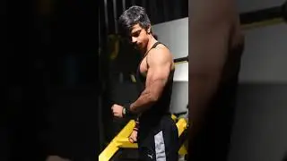 Triceps posing by 20 year old bodybuilder