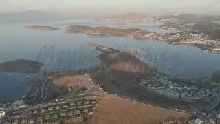 D-Log M. Bodrum, Turkey. Morning aerial panorama of Bodrum windmills ruins in red sunrise glow. A...