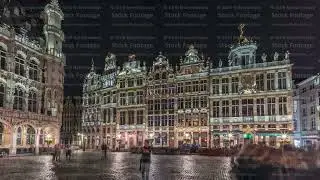 Night hyperlapse of the illuminated Grand Place Guilds facade in Brussels, Belgium.
