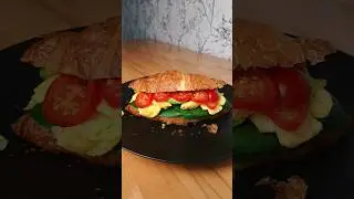 Croissant Sandwich with Ricotta, Spinach, Scrambled Eggs, Avocado and Cherry Tomatoes