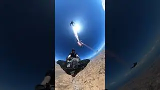 Skydiver and Wingsuiter Perform &ldquo;Wingsuit Rodeo&rdquo; with Smoke