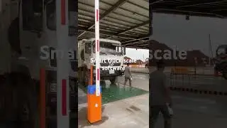 Truck scale software control with barrier and photocell sensors.
