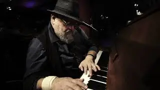 Blues pianist singer Andy from Basel plays St James Infirmary.