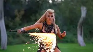 Fuel Girl Hayley, showing off her fire skills with various props.