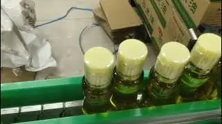 automatic shrink band applicator with electric tunnel for oil bottles #shrinksleevemachine #auto