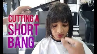 Cutting a short bang for the first time.