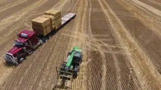 loading a truck with square bales Phantom 4 footage