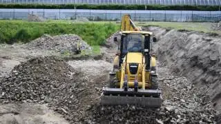 backhoe KOMATSU WB97R at work at Bratislava construction yard