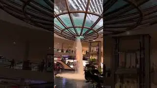 A large whirlpool forms inside a 70-foot diameter acrylic bowl and falls 2 stories to a pool below