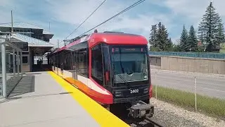 Calgary Transit Siemens Series 9 S200 as Red Line to Tuscany Station departing University Station