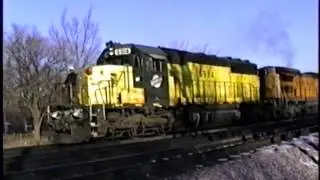 C&NW 6914 and UP 9153 (with flames coming out of the turbo) in Elmhurst, IL during 12/97