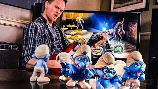Neil Patrick Harris joga Guitar Hero com os Smurfs