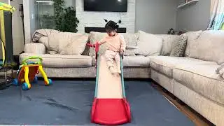 Nepali Kid in USA: Daughter playing with the slide indoor during winter season.