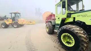 MB Trac 900 Turbo and Teagle Tomahawk 505 milling round bale