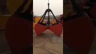 How does a clamshell crane grab work?