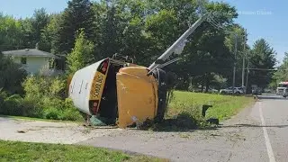 Bus rolls over after crash with car