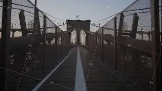 Empty Brooklyn Bridge with no people early morning at sunrise in beautiful sunlight in summer