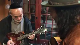 Andy Statman taking a look at my mandolin