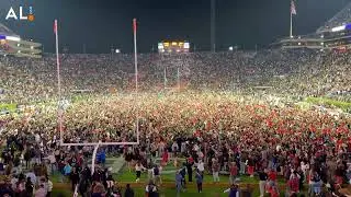 Auburn fans rush the field after Tigers upset No. 15 Texas A&M in 4 overtimes