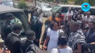 Heavy hearts as John Dumelo and family escort his father’s body out of the church